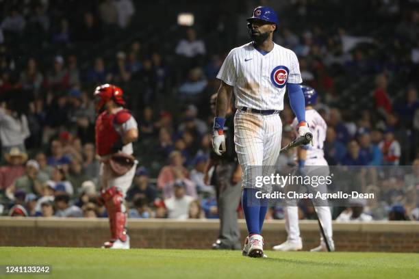 Jason Heyward of the Chicago Cubs walks away from home plate after striking out in the 11th inning of the game against the St. Louis Cardinals at...