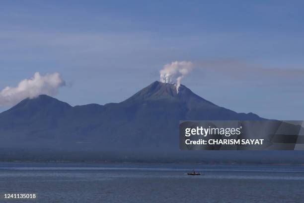 Smoke rises from Bulusan volcano as seen from Sorsogon City, Sorsogon province on June 6, 2022. - The volcano in the eastern Philippines spewed a...