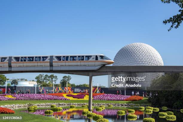 Orange County, Florida A monorail zips past flower displays during the Flower and Garden Festival at Epcot at Walt Disney World in Orange County,...