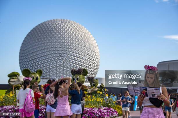 Tourist looks at a park map during the Flower and Garden Festival at Epcot at Walt Disney World in Orange County, Florida on May 30, 2022. Walt...