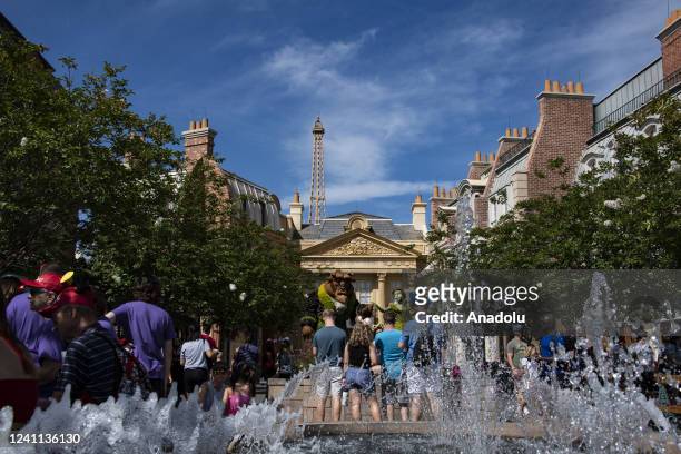 Tourist take photos and explore the France pavilion during the Flower and Garden Festival at Epcot at Walt Disney World in Orange County, Florida on...