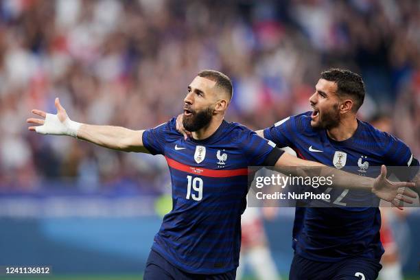 Karim Benzema of France celebrates with Theo Hernandez after scoring his sides first goal during the UEFA Nations League League A Group 1 match...