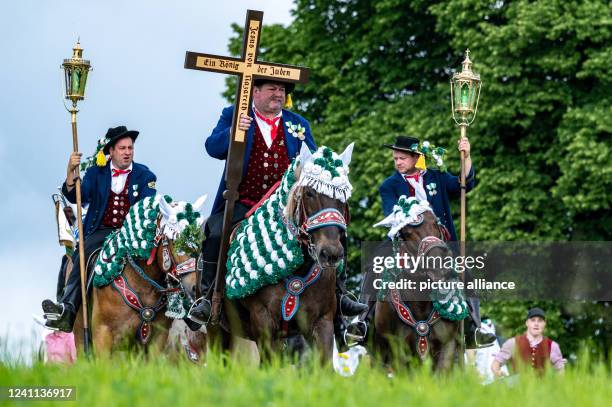 June 2022, Bavaria, Bad Kötzting: Participants of the Kötztinger Pfingstritt ride with their horses on a road. The procession is one of the oldest...