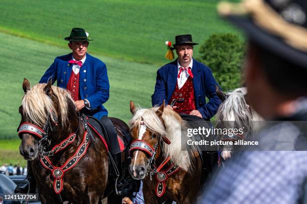 June 2022, Bavaria, Bad Kötzting: Participants of the Kötztinger Pfingstritt ride with their horses on a road. The procession is one of the oldest...