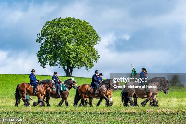 June 2022, Bavaria, Bad Kötzting: Participants of the Kötztinger Pfingstritt ride with their horses on a road. The procession is one of the oldest...