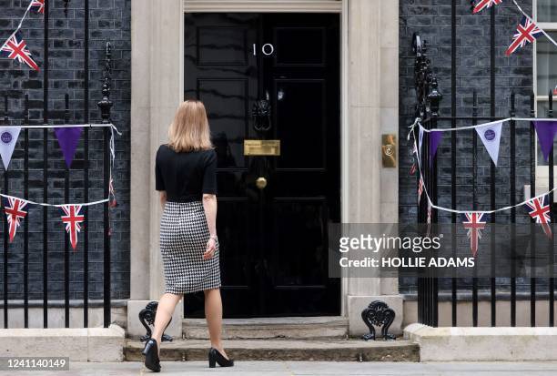 Estonia's Prime Minister Kaja Kallas walks towards the closed door of 10 Downing Street in central London on June 6 as she arrives ahead her meeting...