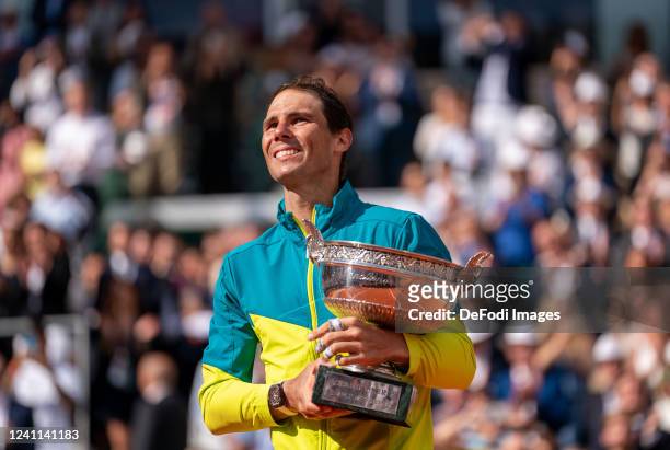 Rafael NADAL of Spain celebrates his victory with the Musketeers Cup after the men's final, on day fifteen of Roland Garros on June 5, 2022 in Paris,...