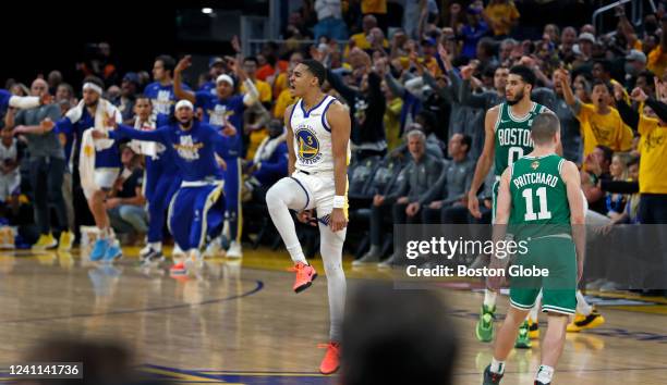 San Francisco The fans and his teammates celebrate after the Warriors Jordan Poole hit a half court shot at the buzzer ending the first half to...