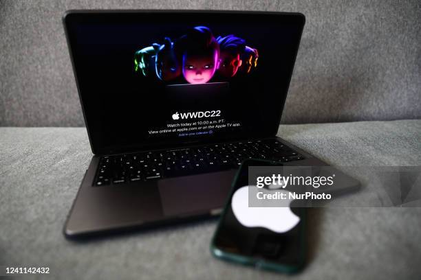 Apple website displayed on a laptop screen and Apple logo displayed on a phone screen are seen in this illustration photo taken in Krakow, Poland on...