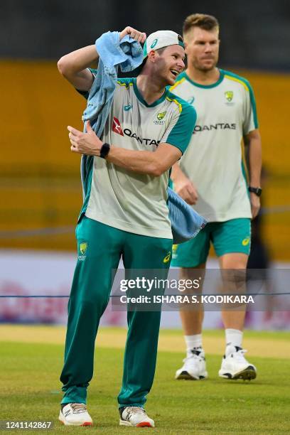 Australia's Steven Smith and teammate David Warner attend a practice session at the R. Premadasa Stadium in Colombo on June 6 ahead of their two...