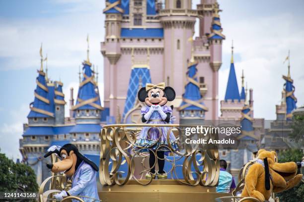 Minnie Mouse and friends take part in a cavalcade parade on Main Street USA at the Magic Kingdom Park at Walt Disney World in Orange County, Florida...