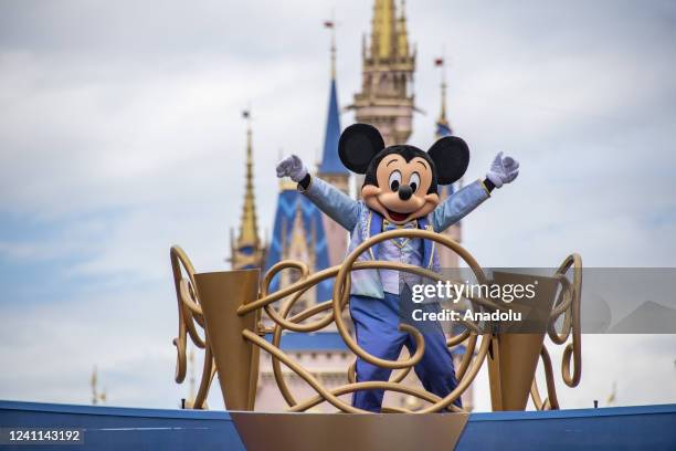 Mickey Mouse and friends take part in a cavalcade parade on Main Street USA at the Magic Kingdom Park at Walt Disney World in Orange County, Florida...