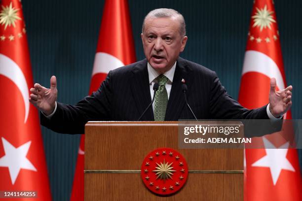 Turkish President Recep Tayyip Erdogan speaks during a press conference following the cabinet meeting at the Presidential Complex in Ankara on June...