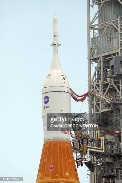 Close-up view showing the Orion spacecraft atop the massive Artemis I Space Launch System rocket at Launch Pad 39B after rolling out from the Vehicle...