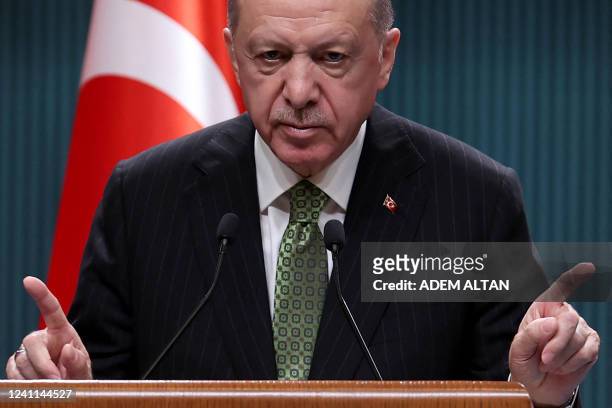 Turkish President Recep Tayyip Erdogan speaks during a press conference following the cabinet meeting at the Presidential Complex in Ankara on June...