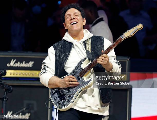 San Francisco Neal Schon, guitarist for the band Journey, plays the national anthem before the start of the game. The Boston Celtics visited the...