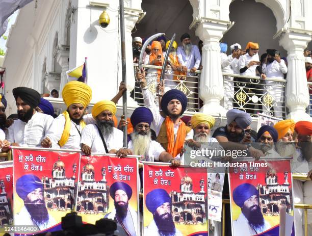 Members of various hardline Sikh organisations raise Pro-Khalistan slogans on the 38th anniversary of Operation Blue Star, at Golden Temple, on June...