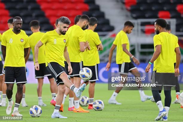 S midfielder Mohammed al-Baloushi dribbles the ball during a training session at the Ahmad bin Ali stadium in the Qatari city of Ar-Rayyan on June 6...
