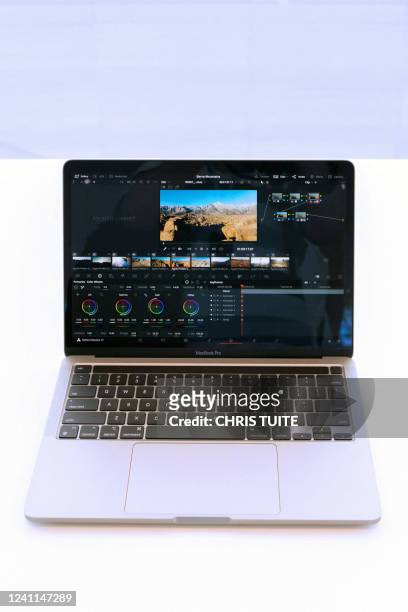 New 13" MacBook Pro is on display inside the Steve Jobs Theater during the Apple Worldwide Developers Conference at the Apple Park campus in...