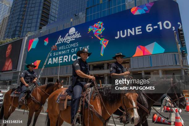 Mounted police patrol the streets around the LA Convention Center during the Summit of the Americas in Los Angeles, California on June 6, 2022.
