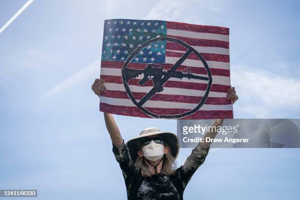 Jane Harman of Takoma Park, Maryland holds up a sign during a rally against gun violence outside the U.S. Capitol on June 6, 2022 in Washington, DC....