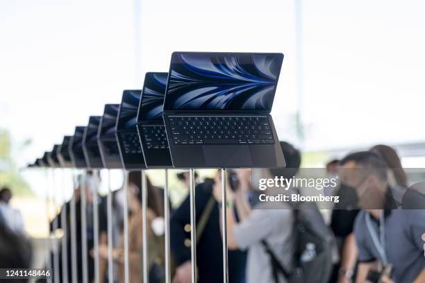 Attendees view the new MacBook Air laptop computer during the Apple Worldwide Developers Conference at Apple Park campus in Cupertino, California,...