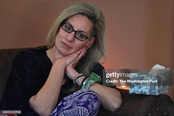 Alicia McAllister Daniels has a quiet moment after she completed an online grief therapy workshop session at her home in Roanoke, Virginia on...