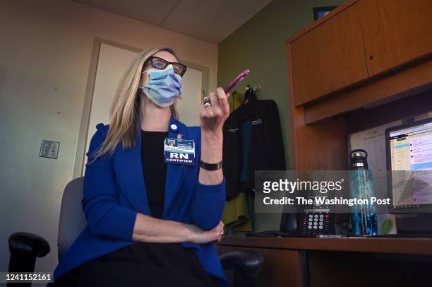 Alicia McAllister Daniels chats in her office with a colleague at Carilion Children's Hospital in Roanoke, Virginia on December 13, 2021. When she...