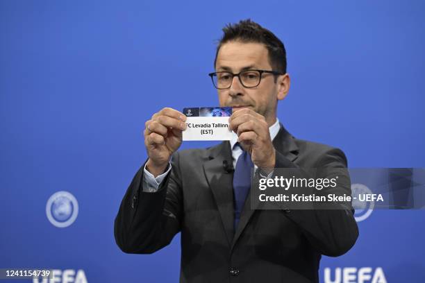 Head of Club Competitions & Calendar Tobias Hedtstück draws out the card of FC Levadia Tallinn during the UEFA Champions League 2022/23 Preliminary...