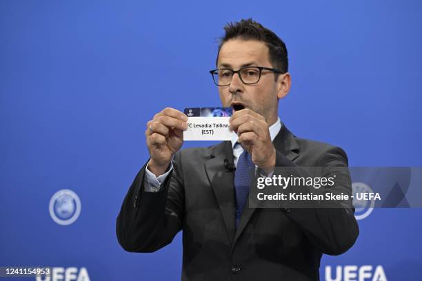 Head of Club Competitions & Calendar Tobias Hedtstück draws out the card of FC Levadia Tallinn during the UEFA Champions League 2022/23 Preliminary...