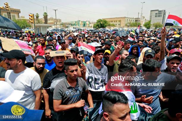 Iraqis protest against the governments employment policy near the parliament building in Baghdad's Green Zone on June 7, 2022. - The unemployment...