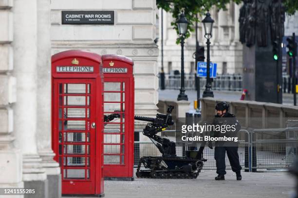 Bomb disposal robot operating beyond a police cordon as officers investigate a suspicious package in the Westminster district of London, UK, on...