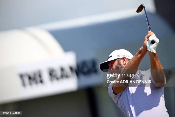 Golfer Dustin Johnson practices on the driving range ahead of ahead of the forthcoming LIV Golf Invitational Series event at The Centurion Club in St...