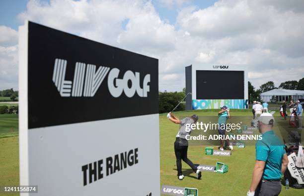 Players practice on the driving range ahead of ahead of the forthcoming LIV Golf Invitational Series event at The Centurion Club in St Albans, north...