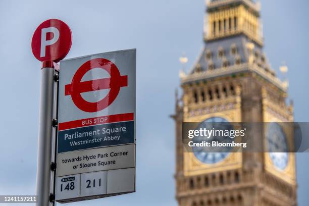 Bus stop at Parliament Square with the bus numbers 148 and 211 in the Westminster district of London, UK, on Tuesday, June 7, 2022. The deep...