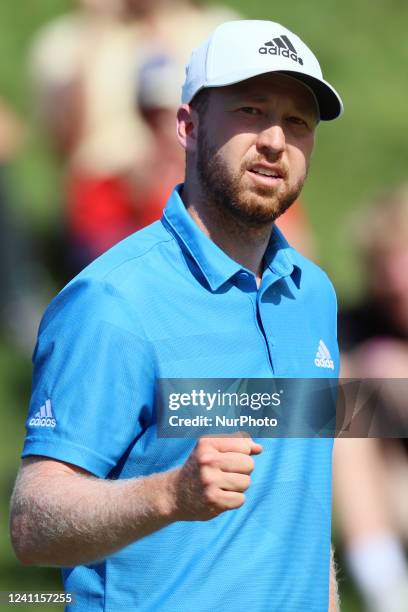 Daniel Berger of Jupiter, Florida reacts after making his putt on the 17th green during the final round of The Memorial Tournament presented by...