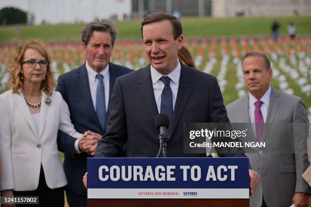 Senator Chris Murphy, Democrat of Connecticut, with former Democratic US Representative Gabby Giffords , speaks during the opening of the Gun...