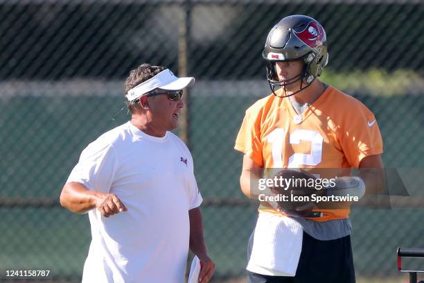 Tampa Bay Buccaneers quarterback coach Clyde Christensen instructs quarterback Tom Brady during the Tampa Bay Buccaneers Minicamp on June 07, 2022 at...