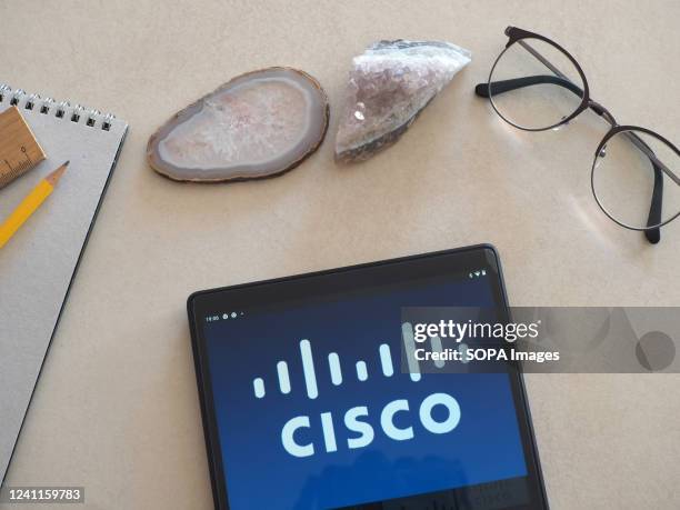 In this photo illustration Cisco Systems, Inc. Logo seen displayed on a tablet.