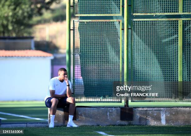 France's forward Kylian Mbappe looks at his teammates during a training session the day after the UEFA Nations League - League A Group 1 football...