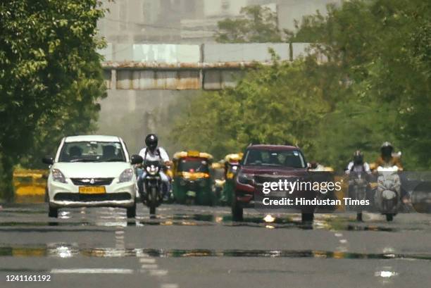 Mirage forms on Vikas Marg due to the scorching heat, on June 6, 2022 in New Delhi, India.