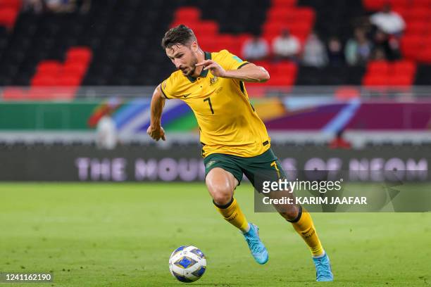 Australia's forward Mathew Leckie runs with the ball during the FIFA World Cup 2022 play-off qualifier football match between UAE and Australia at...