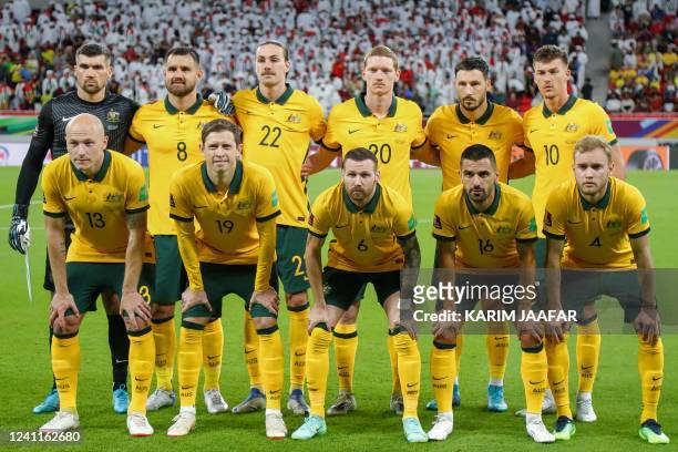 Australia's starting eleven pose for the group photo before the start of the FIFA World Cup 2022 play-off qualifier football match between UAE and...