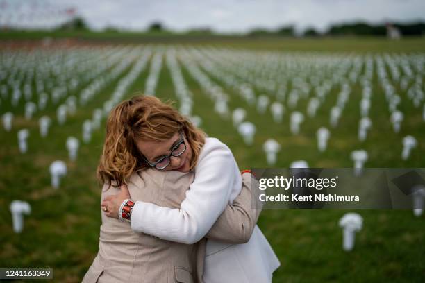 Former Rep. Gabrielle Giffords hugs Rep. Lucy McBath at the Giffords Gun Violence Memorial in front of the Washington Monument on Tuesday, June 7,...