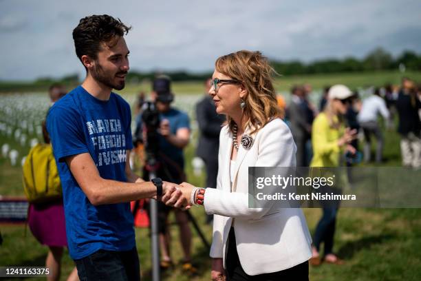 Former Rep. Gabrielle Giffords , right, is greeted by David Hogg, left, at an event at the Gun Violence Memorial in front of the Washington Monument...