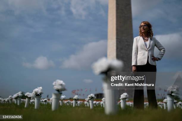 Former Rep. Gabrielle Giffords walks through Giffords Gun Violence Memorial in front of the Washington Monument on Tuesday, June 7, 2022 in...