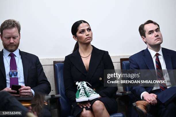 Camila Alves McConaughey holds the shoes of Maite Yuleana Rodriguez, a student who was killed in the mass shooting at Robb Elementary School, as US...