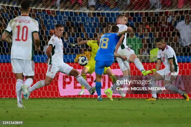 Italy's midfielder Nicolo Barella shoots to open the scoring during the UEFA Nations League - League A, Group 3 first leg football match between...