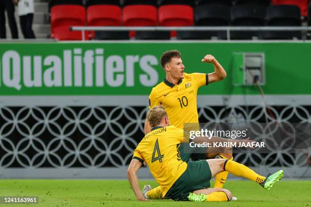 Australia's midfielder Ajdin Hrustic celebrates after scoring his team's second goal during the FIFA World Cup 2022 play-off qualifier football match...