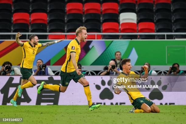 Australia's midfielder Ajdin Hrustic celebrates after scoring his team's second goal during the FIFA World Cup 2022 play-off qualifier football match...